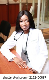 Authentic And Candid Image Of Medical Student In White Medical Robe Sitting At Her Desk In Classroom. Young Girl Surgeon Doctor Wearing Stethoscope.
Concept Of Diversity In Medicine And Education. 