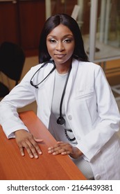 Authentic And Candid Image Of Medical Student In White Medical Robe Sitting At Her Desk In Classroom. Young Girl Surgeon Doctor Wearing Stethoscope.
Concept Of Diversity In Medicine And Education. 