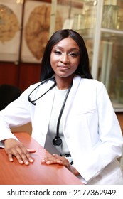 Authentic And Candid Image Of Medical Student In White Medical Robe Sitting At Her Desk In Classroom. Young Girl Surgeon Doctor Wearing Stethoscope.
Concept Of Diversity In Medicine And Education. 