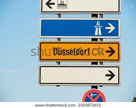 Authentic German road signs pointing to Duesseldorf (Düsseldorf), highway and industrial area, taken in Neuss, Germany, Europe, EU