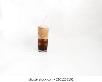 Authentic Greek frappe in 0,2 glass on light background. The coffee was found in 50s in the city of Thessaloniki and has spread worldwide with various variations, Greece, Athens