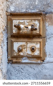 Authentic industrial and rustic charm in this old cast iron cleanout door, featuring original handles and a richly rusted surface. 