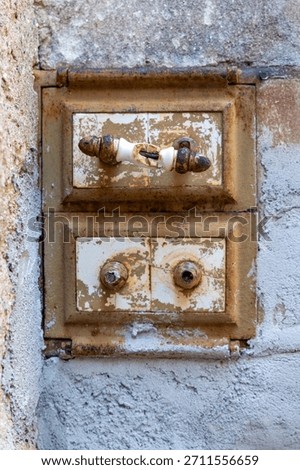 Authentic industrial and rustic charm in this old cast iron cleanout door, featuring original handles and a richly rusted surface. 