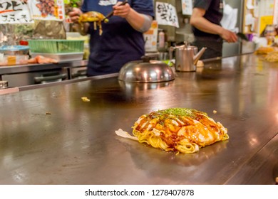 Authentic Japanese Okonomiyaki served at counter in Hiroshima Restaurant