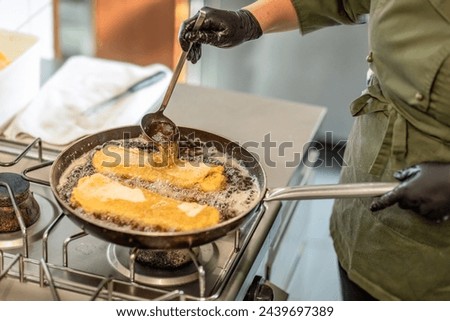 Authentic kitchen scene: Making a cordon bleu in a pan