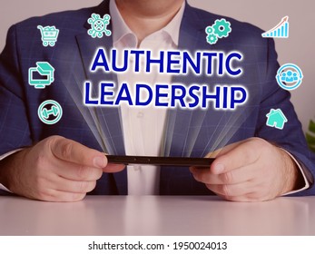  AUTHENTIC LEADERSHIP Inscription On The Screen. Close Up Marketing Expert Hands Holding Black Smart Phone. 
