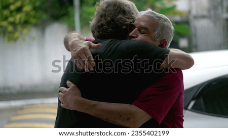 Authentic Loving Embrace Between Two Senior Friends Saying Farewell, Heart-warming Hug of Elderly People, Real Life Family Connection and Affection