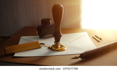 Authentic medieval way to write a letter. Old retro pen dipped in special ink. Concept of writing a letter, invitation in the past and history. The 18th-century technique of mailing.  - Shutterstock ID 1979177789