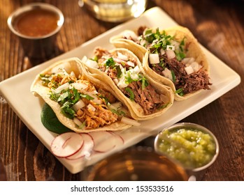 authentic mexican barbacoa, carnitas and chicken tacos - Shutterstock ID 153533516