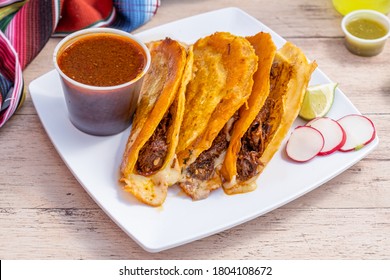 Authentic Mexican barria tacos served from a Mexican food truck. Deep fried tacos filled with beef and cheese. Yummy food from Mexico.