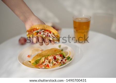 Authentic mexican tacos with beer. Mexican tacos with ground meat, beef, beans, onions and salsa