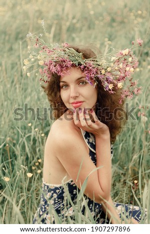 Similar – Woman posing in field of white flowers