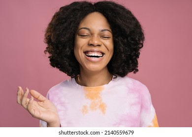 Authentic Portrait Of Beautiful Smiling African Woman Wearing Stylish Tie Dye T Shirt Isolated On Pink Background. Positive Lifestyle