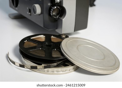 Authentic Reels with old 8mm films against the background of an old film projector. Close-up. Home movies from the 70s - Powered by Shutterstock