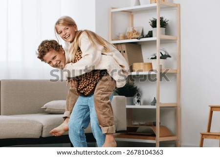 Authentic scene of playful interaction between caregiver and child, showcasing a game themed moment at home that blends everyday life with learning, school routines, and family bonding.