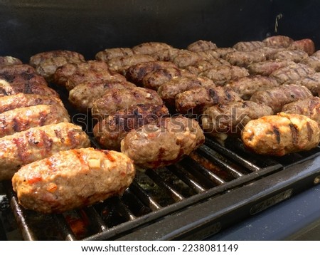Authentic serbian mini sausage links Leskovacki gurmanski cevapi on the grill