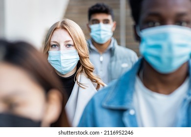 Authentic Shot Of Multiracial People In The City Wearing Face Mask And Walking On The Pavement Commuting To Work - Lifestyle And Health Issues Concepts