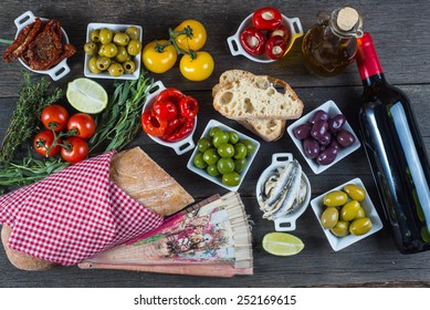 Authentic spanish tapas selection on wooden table from above