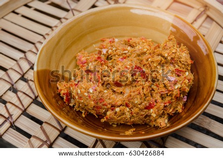 Authentic Thai Red Curry Paste Recipe in 
a bowl on wood background