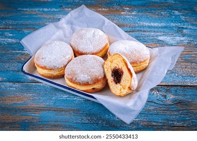 authentic traditional german festive Krapfen Berliner - jam doughnut with icing sugar a - Powered by Shutterstock