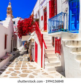 Authentic traditional Greece. Mykonos island. Charming colorful floral streets of old Chora village.  Cyclades - Shutterstock ID 1994136848