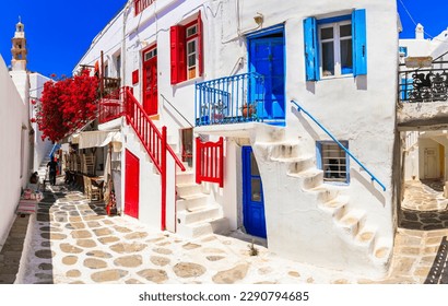 Authentic traditional Greece. Mykonos island. Charming colorful floral streets of old Chora village.  Cyclades - Shutterstock ID 2290794685