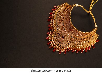 Authentic Traditional Indian Jewellery Necklace On Dark Background. Wear in Neck in Wedding, Festivals And Other Occasion. Very Useful Image For Website, Printing & Mobile Application.