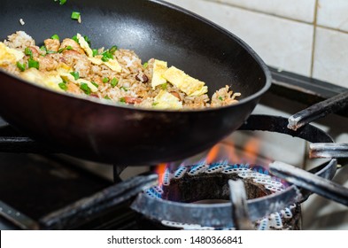 Authentic And Traditional Peruvian Chaufa Rice, Cooking In The Kitchen Near The Stove