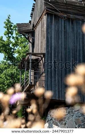 Authentic Ukrainian house in countryside. Summer village in Ukraine. Old folk thatched house. Ukrainian traditional rustic house. Rural countryside in summer ranch. Old architecture, low angle