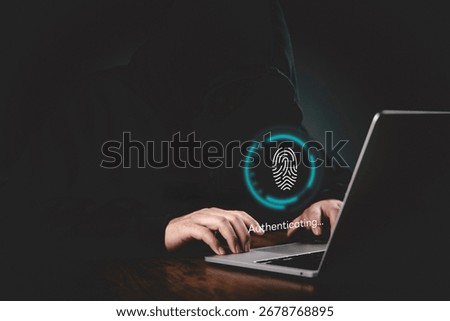 Authentication, Security Hands on a keyboard with a glowing fingerprint UI authenticating on a laptop to demonstrate protected access, data protection, and cyber threat concept.