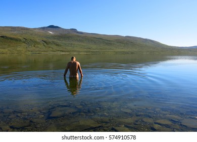 Author takes a swim in norwegian mountains.