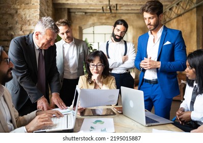 Authoritative Business Woman Consulting His International Team To Facing The Energy Global Crisis - Group Of Multiethnic People Working On Renewable And Sustainable Power