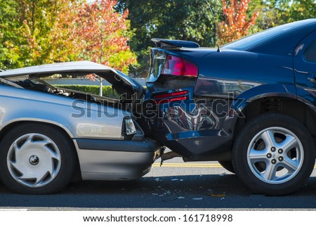 Auto accident involving two cars on a city street