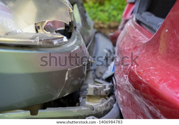 Auto\
accident involving two cars on a city street -\
Image