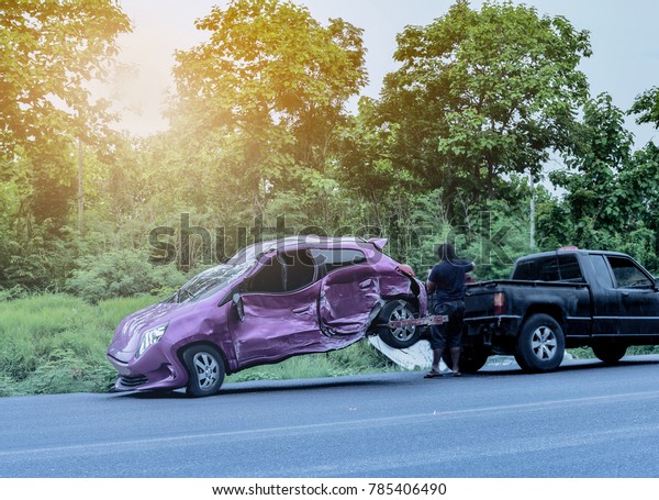 auto accident on\
road on forest background