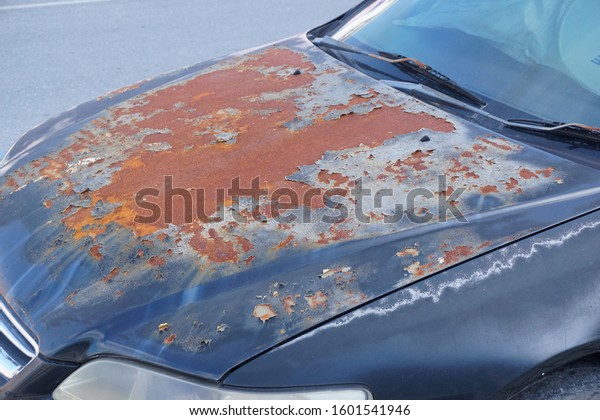 Auto body paint peeling\
and rusted.