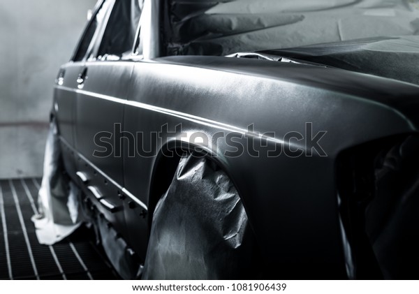 Auto\
body repair series: Freshly paint car in paint\
booth