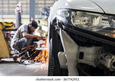 Auto body repair series :  Mechanic grinding car body