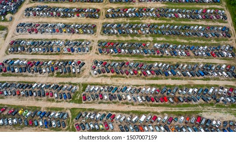An Auto Bone Yard Filled With Old Rusting Cars That Will Never Come Back To Life.