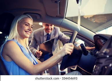 Auto Business, Car Sale, Consumerism And People Concept - Happy Woman With Car Dealer In Auto Show Or Salon