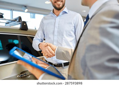 Auto Business, Car Sale, Deal, Gesture And People Concept - Close Up Of Happy Man And Car Dealer With Tablet Pc Computer Shaking Hands In Auto Show Or Salon