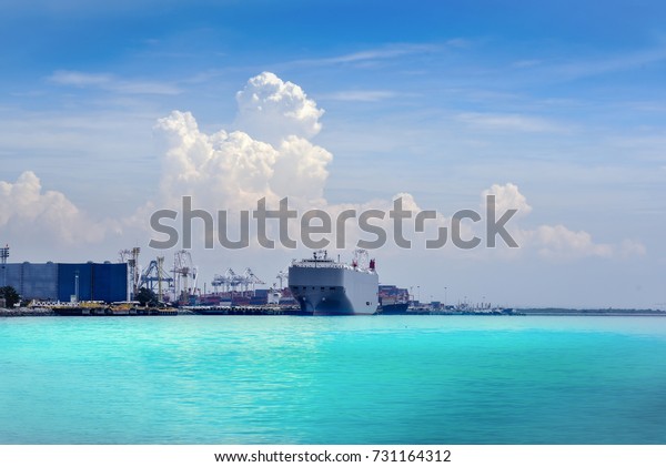 Auto car carrier ship, designed for\
transportation of cars on port\
background