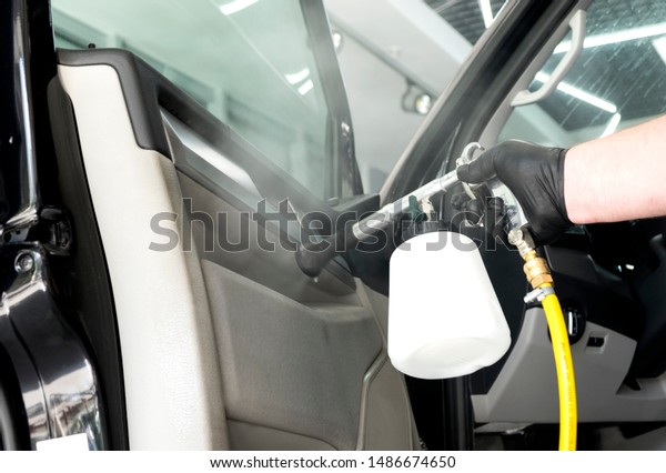 Auto car service cleaning car, cleaning and\
vacuuming leather