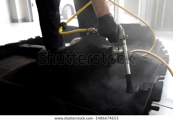 Auto car service cleaning car, cleaning and\
vacuuming leather