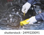 Auto check, car service shop concept. Automobile repairman work checking change engine oil, lubricant to estimate repair motor machine by engineer, mechanic inspecting maintenance at vehicle garage.