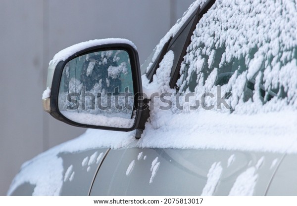 Auto covered with\
snow in nature. Winter