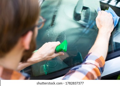 Auto Detailing. Man Cleaning A Car With Car Cosmetics. 