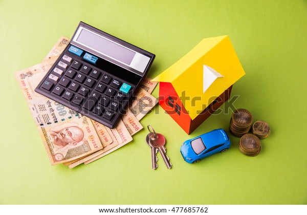 Auto Finance and Housing Loan or purchase in India\
-  Concept showing 3D Car and house model, keys, indian currency\
notes and calculator etcAuto Finance and Housing Loan or purchase\
in India -  Concep