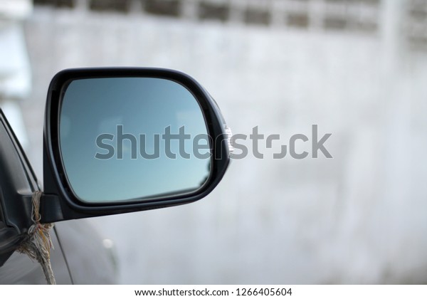 Auto glass with reflection of the landscape in\
the daytime
