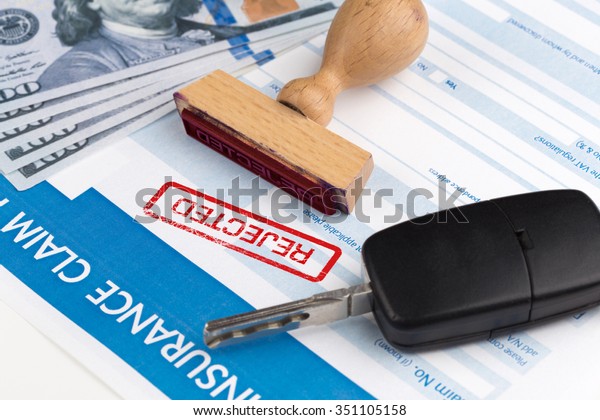 auto
insurance claim form with dollar and car
key